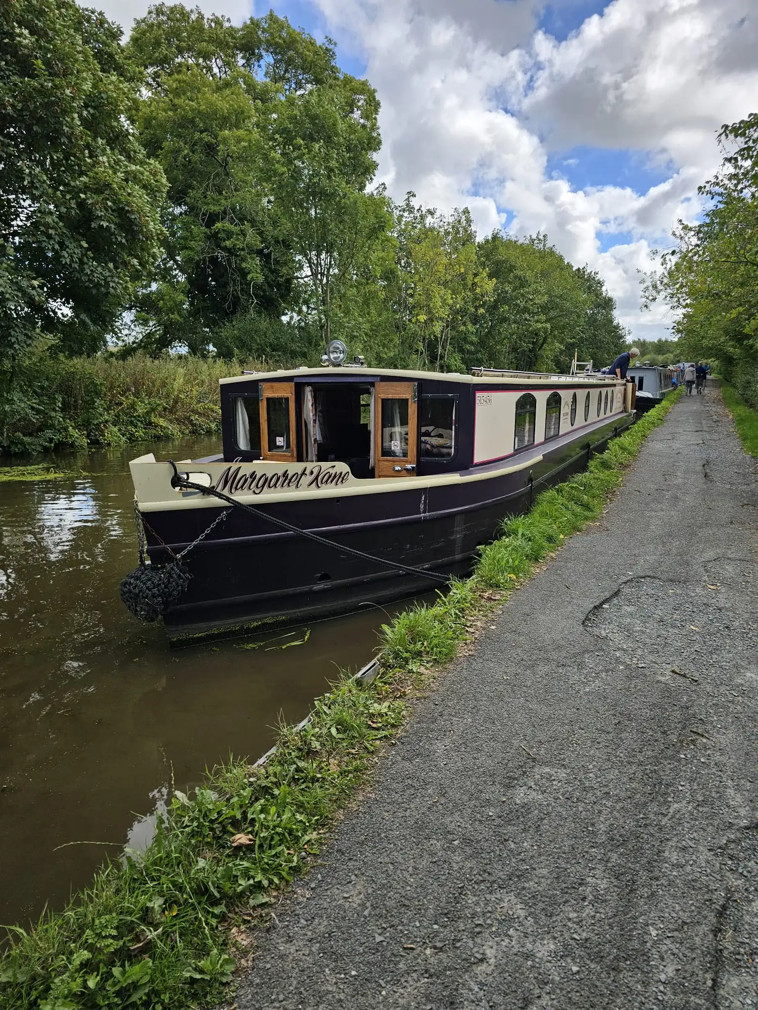 The Margaret Kane wide-beam barge, venue for Claire Stockton's book signing, moored on a Lancashire canal