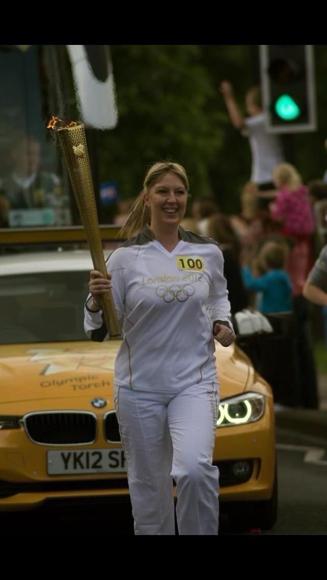 Claire carrying the Olympic torch
