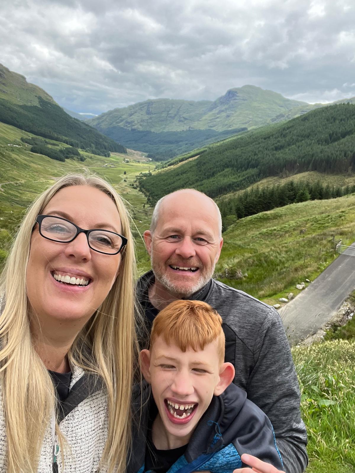 Claire, Carl and Finley in the Scottish hills